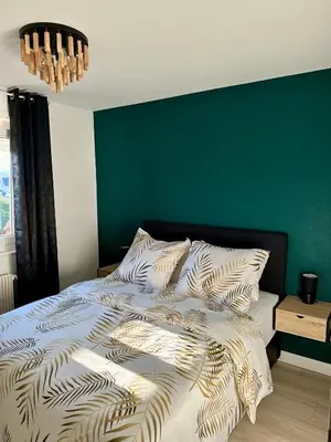 Un ou plusieurs lits dans un hébergement de l'établissement Flori'Home