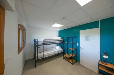 Un ou plusieurs lits dans un hébergement de l'établissement Le chalet de l'amicale