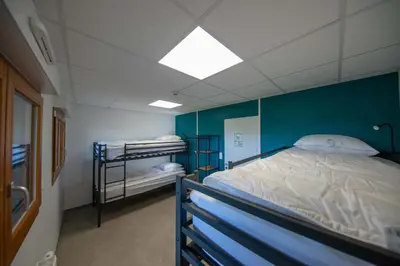 Un ou plusieurs lits dans un hébergement de l'établissement Le chalet de l'amicale