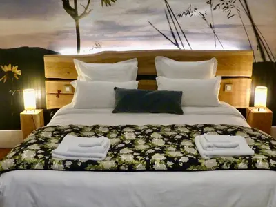 Un ou plusieurs lits dans un hébergement de l'établissement Chambre suite Arnica