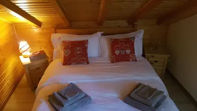 Un ou plusieurs lits dans un hébergement de l'établissement Chalet Les Bouvreuils La Bresse Haute Vosges