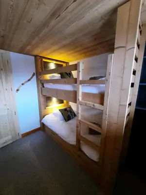 Un ou plusieurs lits dans un hébergement de l'établissement Chalet Les Bouvreuils La Bresse Haute Vosges