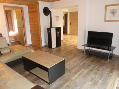 Télévision ou salle de divertissement dans l'établissement LE MASSIF - Appartements tout confort avec vue