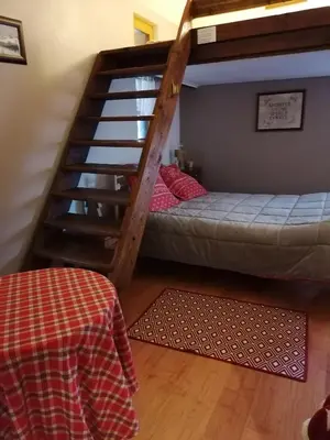 Un ou plusieurs lits dans un hébergement de l'établissement Chambres d'hôtes chez Loulou et Caramel
