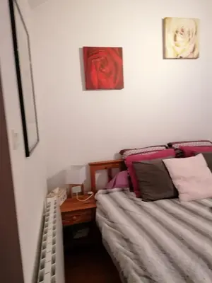 Un ou plusieurs lits dans un hébergement de l'établissement Chambres d'hôtes chez Loulou et Caramel