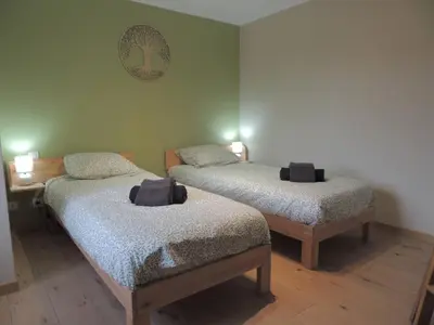 Un ou plusieurs lits dans un hébergement de l'établissement Cocon de la belle de Vosges 3 chambres