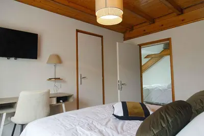 Un ou plusieurs lits dans un hébergement de l'établissement Maison Capdet