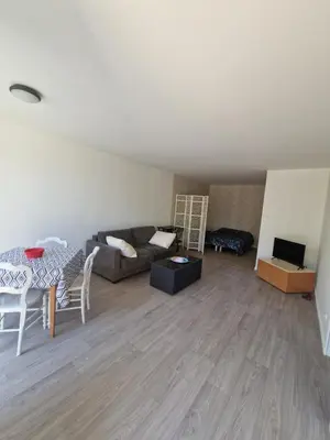 Coin salon dans l'établissement l'appart en rez de jardin