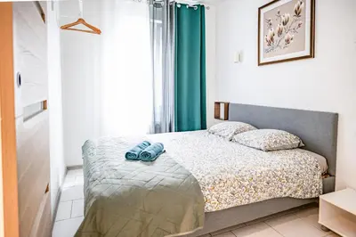 Un ou plusieurs lits dans un hébergement de l'établissement Mega COOL Flat France Suisse
