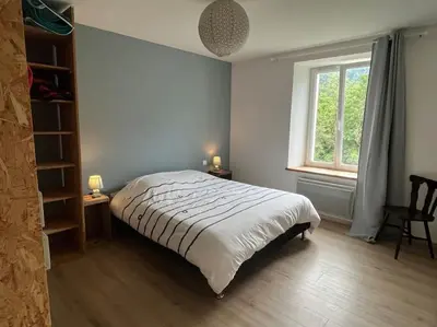 Un ou plusieurs lits dans un hébergement de l'établissement Appartement 5 personnes avec espace plein air