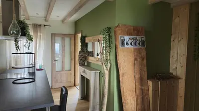Cuisine ou kitchenette dans l'établissement Le Jardin d Eden