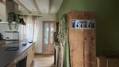 Cuisine ou kitchenette dans l'établissement Le Jardin d Eden