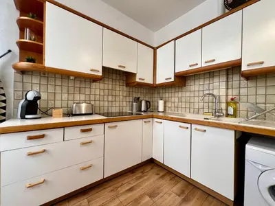 Cuisine ou kitchenette dans l'établissement Le Petit Moulin