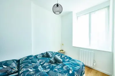 Un ou plusieurs lits dans un hébergement de l'établissement Bel appartement cosy, tram au pied du logement