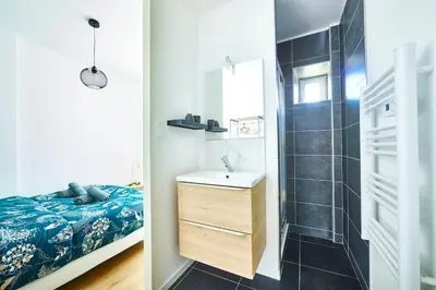 Un ou plusieurs lits dans un hébergement de l'établissement Bel appartement cosy, tram au pied du logement