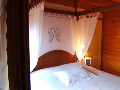 Un ou plusieurs lits dans un hébergement de l'établissement B&B Chalet l'Epinette