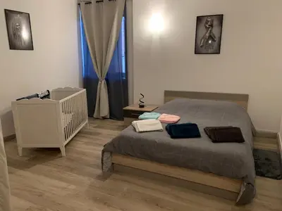 Un ou plusieurs lits dans un hébergement de l'établissement Spacieux 61 metres carré tout confort