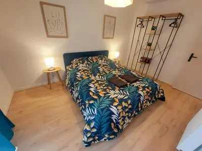 Un ou plusieurs lits dans un hébergement de l'établissement Appartement 3 ch avec garage, proche Techn'hom