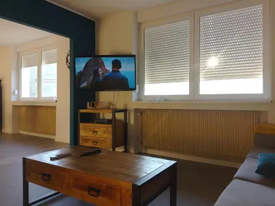 Télévision ou salle de divertissement dans l'établissement Comme chez Soi