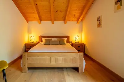 Un ou plusieurs lits dans un hébergement de l'établissement Chalet Neuf 10 personnes, Piscine et Spa
