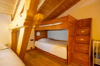 Un ou plusieurs lits dans un hébergement de l'établissement Chalet Neuf 10 personnes, Piscine et Spa