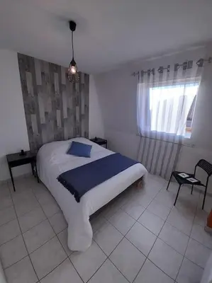 Un ou plusieurs lits dans un hébergement de l'établissement Le Maraîcher avec terrasse, wifi, parking gratuit