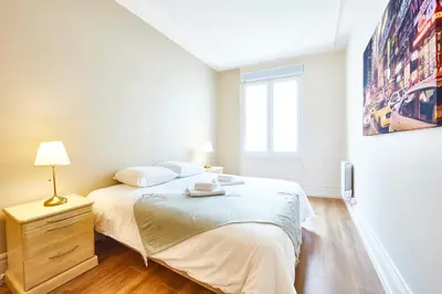 Un ou plusieurs lits dans un hébergement de l'établissement RI-2 Charmant et spacieux 3 pièces tout confort à Mulhouse centre