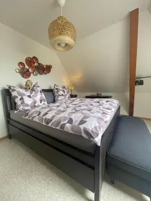 Un ou plusieurs lits dans un hébergement de l'établissement Le Square Appartement spacieux F2 avec terrasse, garage près de Colmar