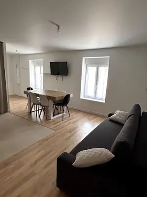 Télévision ou salle de divertissement dans l'établissement Appartement proche La Bresse