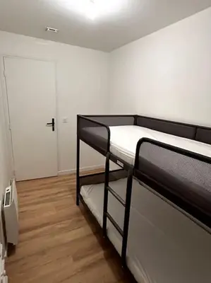 Un ou plusieurs lits dans un hébergement de l'établissement Appartement proche La Bresse