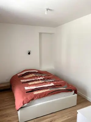 Un ou plusieurs lits dans un hébergement de l'établissement Appartement proche La Bresse