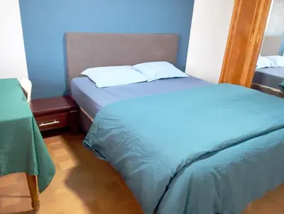 Un ou plusieurs lits dans un hébergement de l'établissement Apartement 2 rooms Saint Louis - Euroairport - Basel - Train station