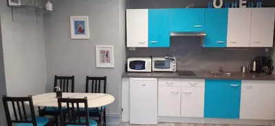 Cuisine ou kitchenette dans l'établissement Au Coup de Cœur