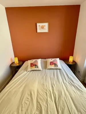 Un ou plusieurs lits dans un hébergement de l'établissement Charmant Appartement Mulhouse