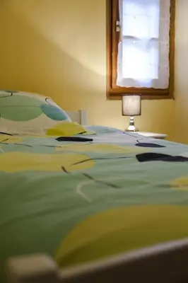 Un ou plusieurs lits dans un hébergement de l'établissement Gîte les Cigogneaux
