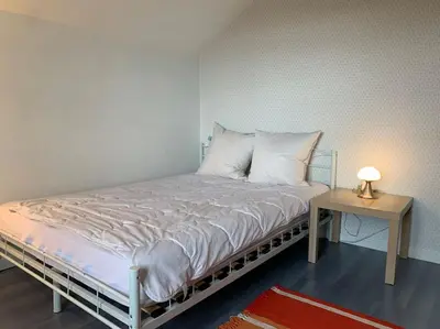 Un ou plusieurs lits dans un hébergement de l'établissement Gîte Au bout des Mynes avec vue panoramique
