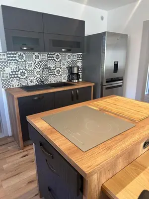 Cuisine ou kitchenette dans l'établissement Gîte 10 personnes