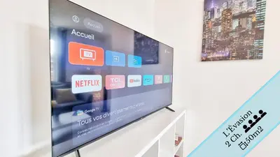 Télévision ou salle de divertissement dans l'établissement Résidence Évasion & Élégance - Mulhouse