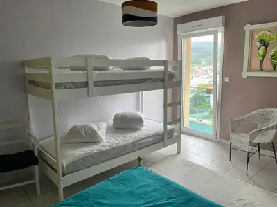 Un ou plusieurs lits dans un hébergement de l'établissement Maison avec jardin Gérardmer L'AUTOUR