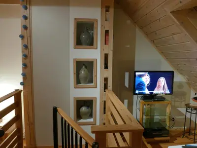 Télévision ou salle de divertissement dans l'établissement Les Trois Lanternes