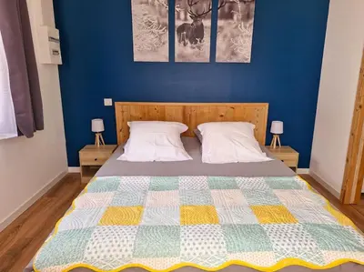 Un ou plusieurs lits dans un hébergement de l'établissement Magnifique appartement Jonquille