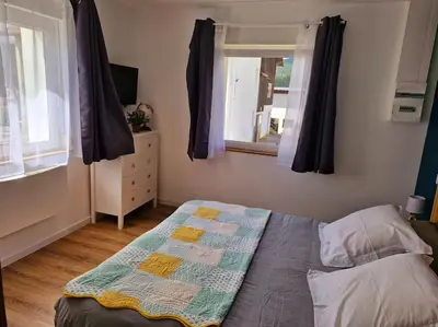 Un ou plusieurs lits dans un hébergement de l'établissement Magnifique appartement Jonquille