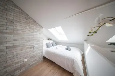 Un ou plusieurs lits dans un hébergement de l'établissement Superbe appartement climatisé parking free