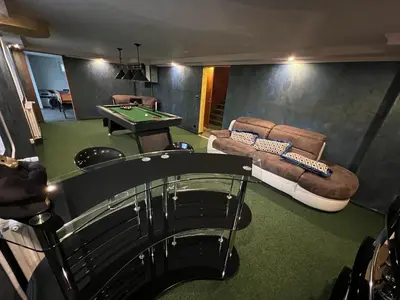 Coin salon dans l'établissement Maison De Luxe Pour 14 personnes - SPA - Billard - Sport - Baby-foot