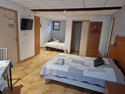 Un ou plusieurs lits dans un hébergement de l'établissement Chez Anabel et Stéphane