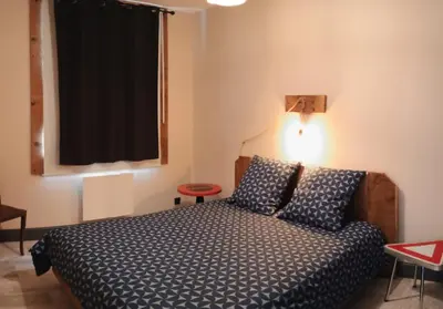 Un ou plusieurs lits dans un hébergement de l'établissement Appartement Le Bihé La Bresse