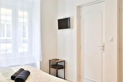 Télévision ou salle de divertissement dans l'établissement Le carré central A Mulhouse