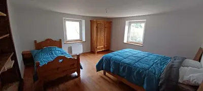 Un ou plusieurs lits dans un hébergement de l'établissement Spacious apartment close to skiing and nature !