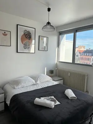 Un ou plusieurs lits dans un hébergement de l'établissement Duplex 65m2 lumineux avec vue sur le chateau 3 étoiles