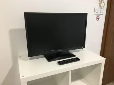 Télévision ou salle de divertissement dans l'établissement Le Calme en plein centre ville de BELFORT